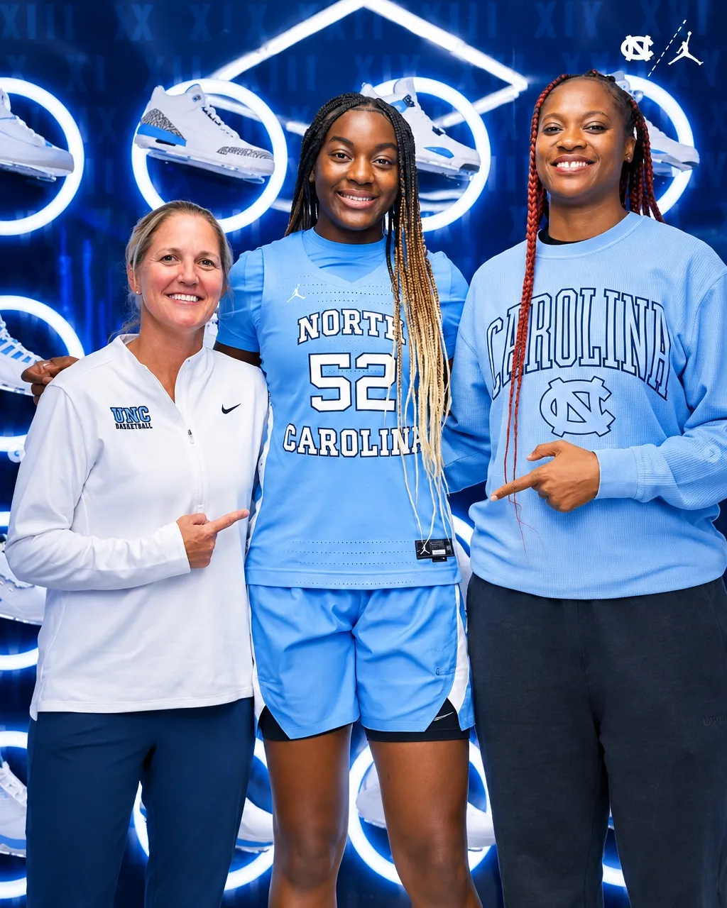 Noelle Bofia with two North Carolina coaches on the basketball court