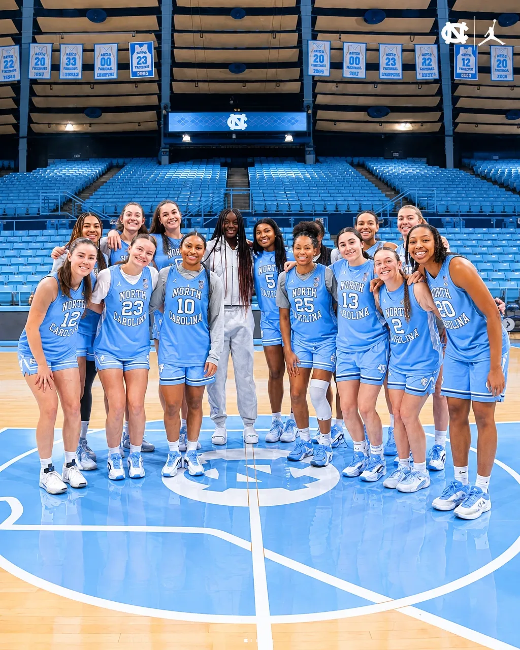 Noelle Bofia with the full North Carolina women's basketball squad on the court